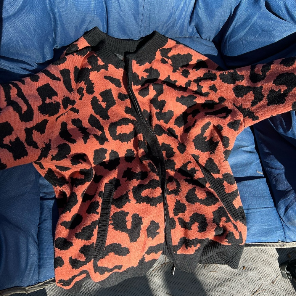 Torrid orange and black leopard print zip up sweater